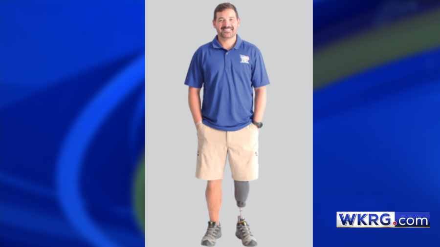 Photo of Marine Staff Sergeant Johnny Morris II on a blue background with the WKRG.com logo