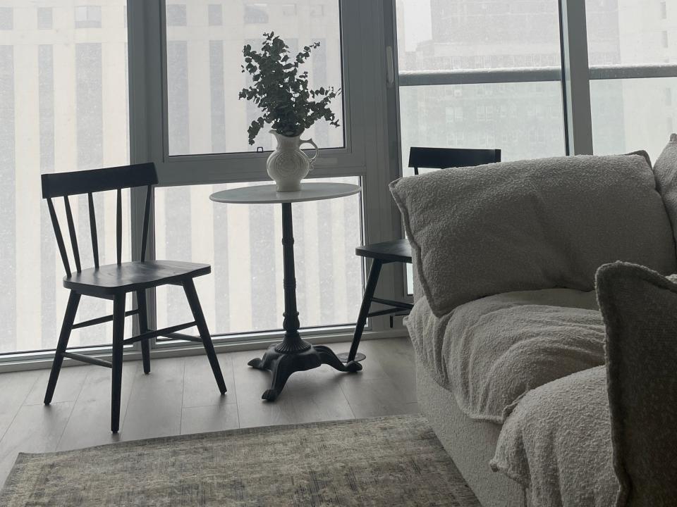 the inside of an apartment on a rainy day