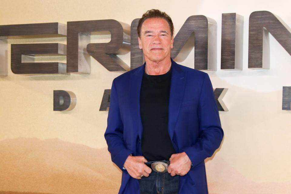 72-year-old Arnold Schwarzenegger is not aging as he stuns in a blue suit-jacket with black inner wear and pant to match