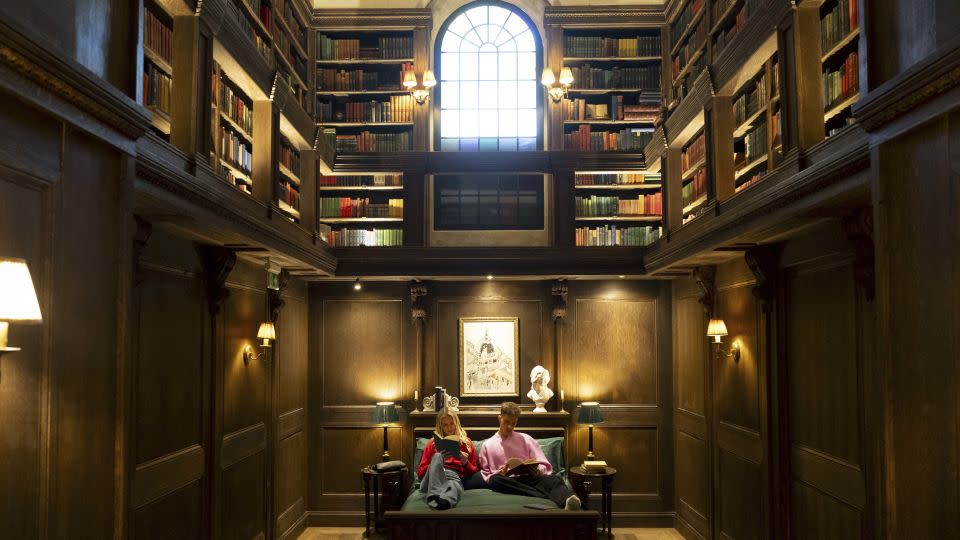 Opening up the doors to the Hidden Library for a once-in-a-lifetime stay, guests will be able to peruse a curated collection of more than 22,000 books for a night of reading. - Jordan Pettitt/Press Association/AP