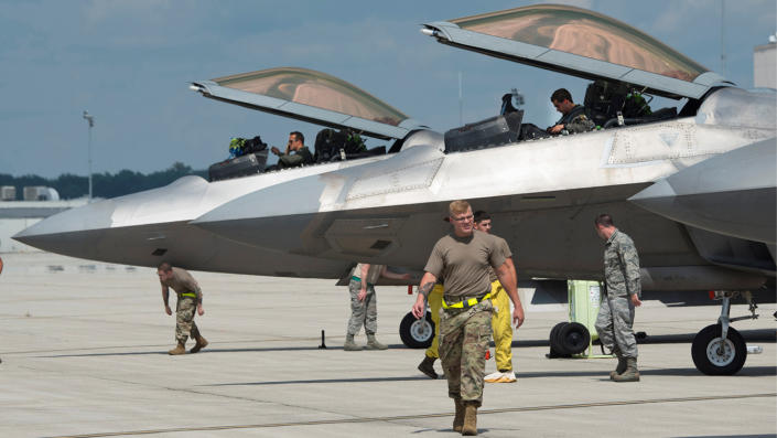 Air Force pilots and aircraft mechanics of the 325th Fighter Wing secure F-22 Raptor aircraft relocating due to Hurricane Laura in August. (U.S. Air Force/R.J. Oriez/Handout via Reuters)