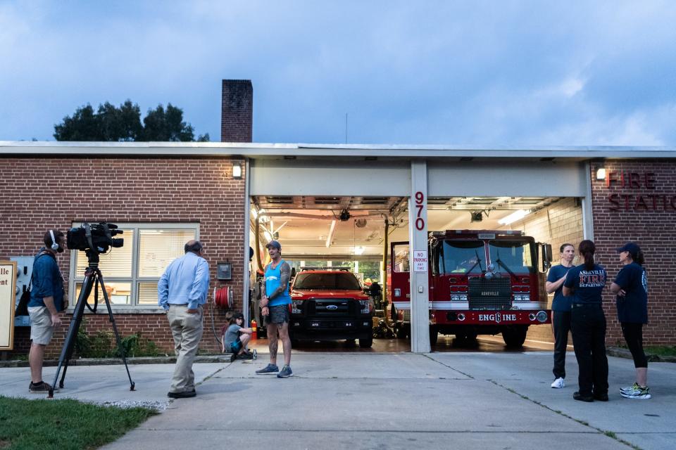 Mikey Riley, an Asheville firefighter, is interviewed at station 6 on Haywood Road before beginning his 100k run to Ebbs Chapel and back Oct. 8, 2018. He ran a mile for every firefighter who has ever been diagnosed with cancer in an effort to raise awareness of firefighters' higher risk of cancer than the general population.