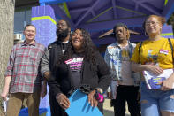 In this March 15, 2022 photo, Louisville mayoral candidate Shameka Parrish-Wright stands with volunteers and campaign staff at Shawnee Community Center in Louisville, Ky. In 2020, Parrish-Wright joined monthslong protests in downtown Jefferson Square Park, where she became a voice for protesters to the media.(AP Photo/Piper Hudspeth Blackburn)