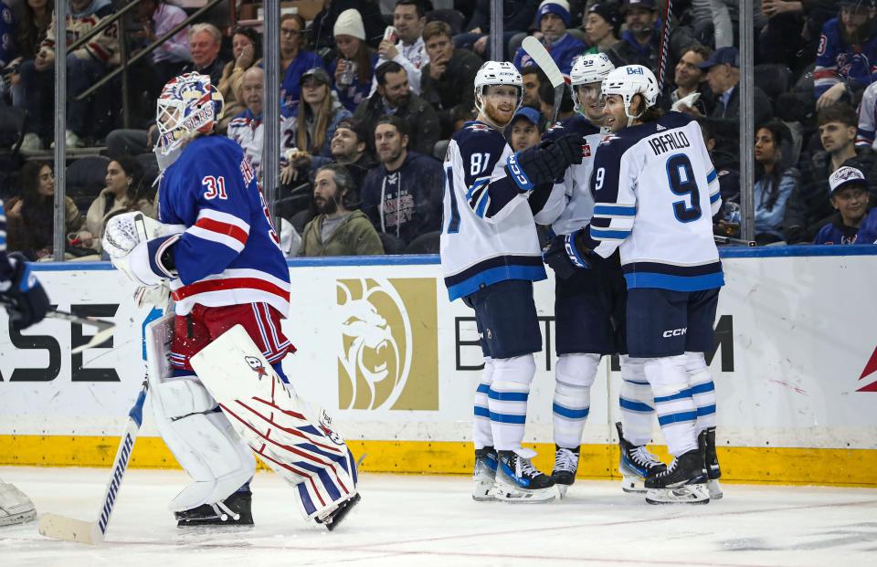 Mar 19, 2024; New York, New York, USA; Winnipeg Jets center Mark Scheifele (55) celebrates his goal against the New York Rangers with left wing Kyle Connor (81) and left wing Alex Iafallo (9) during the second period at Madison Square Garden.