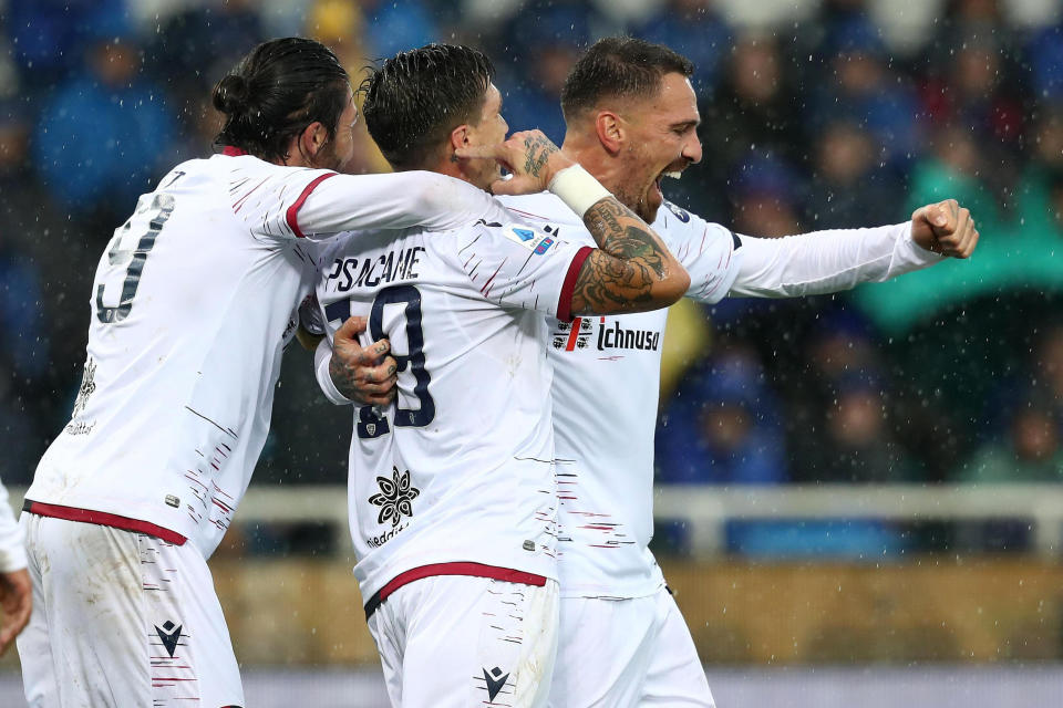 Cagliari's players celebrate after Atalanta's Mario Pasalic scored an own-goal during the Italian Serie A soccer match between Atalanta and Cagliari at the Gewiss Stadium in Bergamo, Italy, Sunday, Nov. 3, 2019. (Paolo Magni/ANSA via AP)