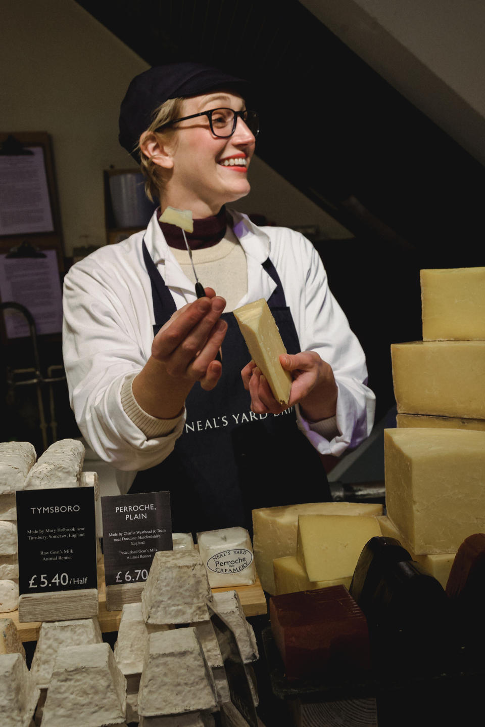 Me working as a cheesemonger at London’s famed cheese shop Neal’s Yard Dairy. (Jacob Harrell)