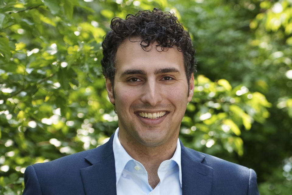 In this photo provided by the Regunberg Campaign, Aaron Regunberg, a Democratic candidate for Rhode Island House District 1, poses on June 21, 2023. Primaries will be held Sept. 5 for the seat vacated by Democratic Rep. David Cicilline's resignation. (Sam Eilertsen/Regunberg Campaign via AP)