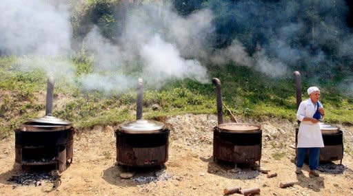 A local resident prepares food for the Sunet (circumcision) Festival in the village of Lubinje, in the Shar mountains that form the border between Kosovo and Macedonia. They are part of a small Muslim community that settled along the Kosovo boundary with Macedonia, some 120 kilometres (74 miles) south of the capital Pristina