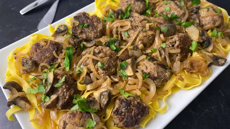Meatballs with mushrooms on egg noodles