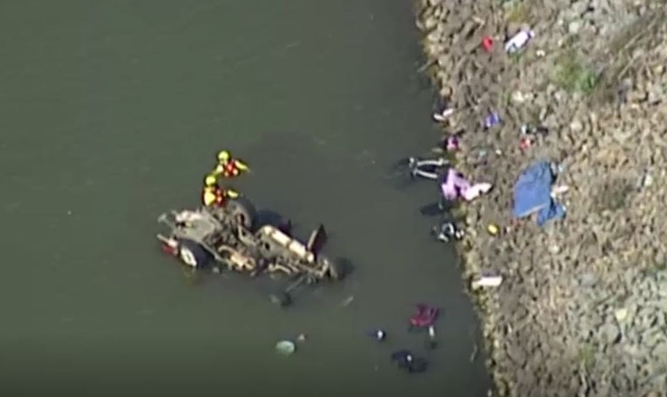 Divers at the scene of a horrific crash in which two children were killed. Source: ABC