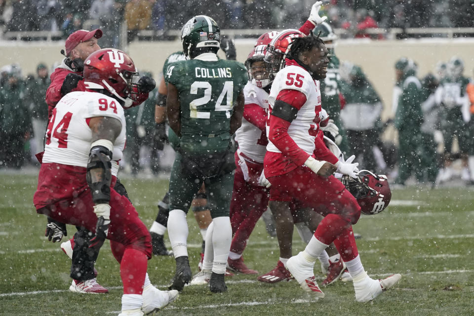 Indiana team members react after the second overtime of an NCAA college football game against Michigan State, Saturday, Nov. 19, 2022, in East Lansing, Mich. (AP Photo/Carlos Osorio)