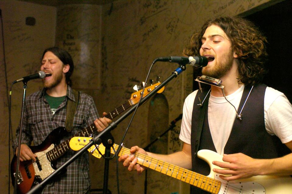 In this Tribune file photo, brothers Jimmy DeWald, left, and Vince DeWald are shown performing with their band, Buxter Hoot'n, at the Midway Tavern on June 18, 2009.