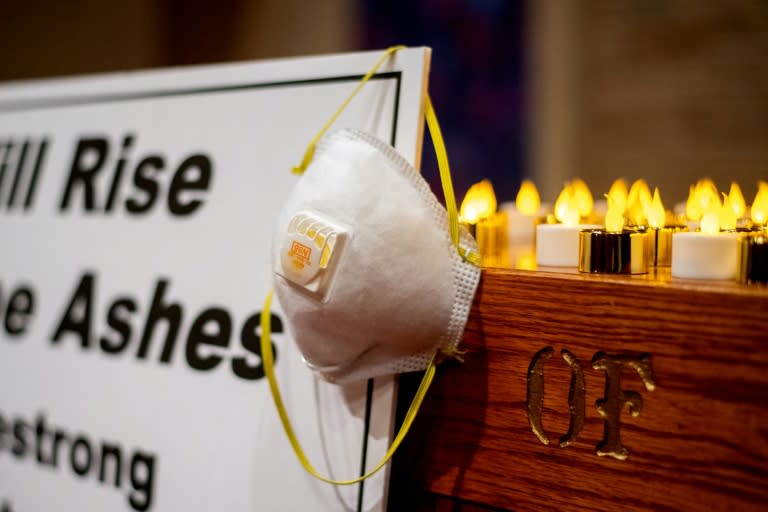 "We will rise from the ashes," said a sign on the altar at the church vigil for fire victims in Chico, California