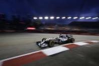 Mercedes Formula One driver Lewis Hamilton of Britain drives during the first practice session of the Singapore F1 Grand Prix at the Marina Bay street circuit in Singapore September 19, 2014. REUTERS/Pablo Sanchez