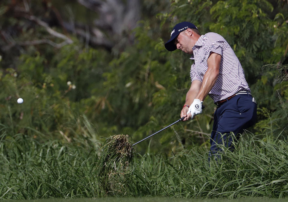 Justin Thomas hits out of the rough on the fourth fairway during the second round of the Tournament of Champions golf event Friday, Jan. 4, 2019, at Kapalua Plantation Course in Kapalua, Hawaii. (AP Photo/Matt York)