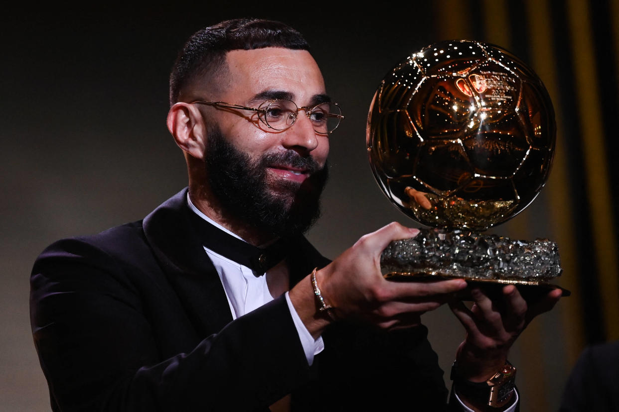 Real Madrid's French forward Karim Benzema receives the Ballon d'Or award during the 2022 Ballon d'Or France Football award ceremony at the Theatre du Chatelet in Paris on October 17, 2022. (Photo by FRANCK FIFE / AFP)