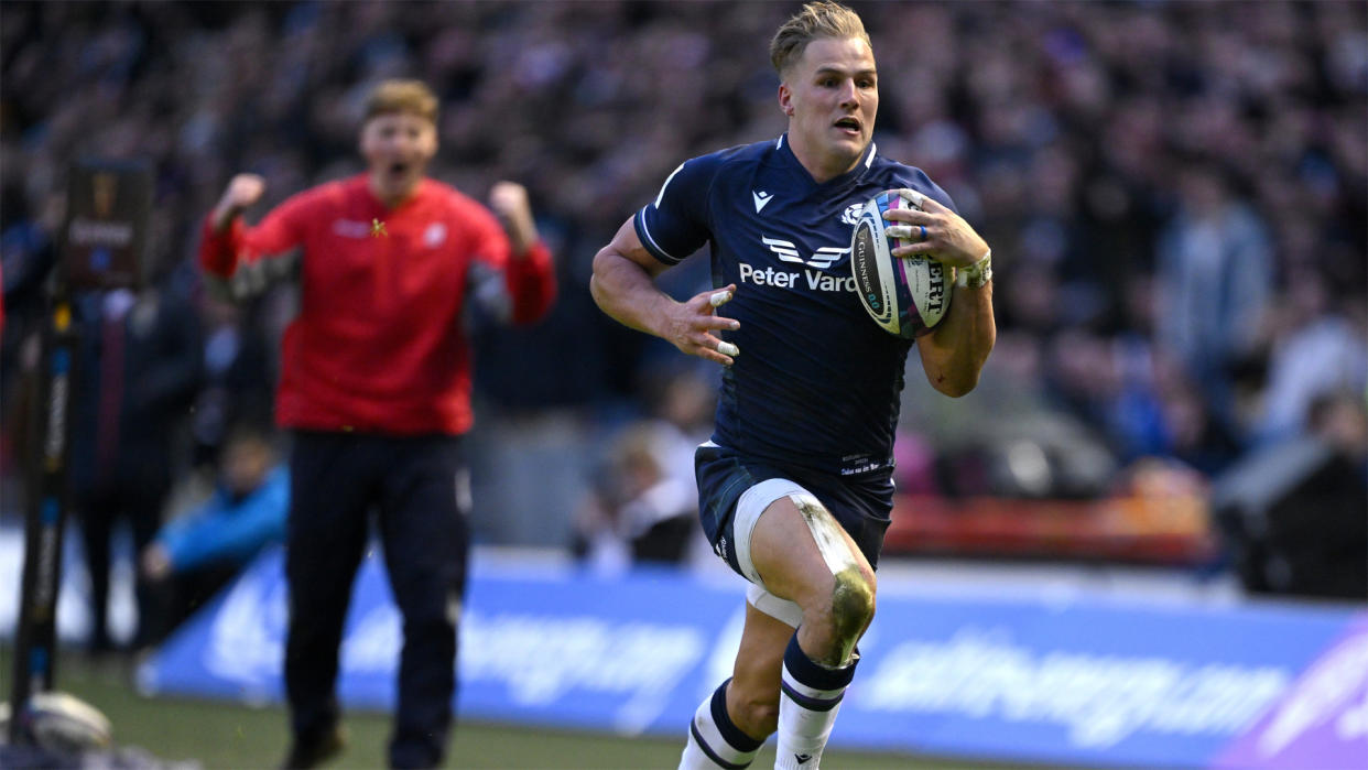  Scotland's Duhan van der Merwe on the way to scoring his second try against England. 