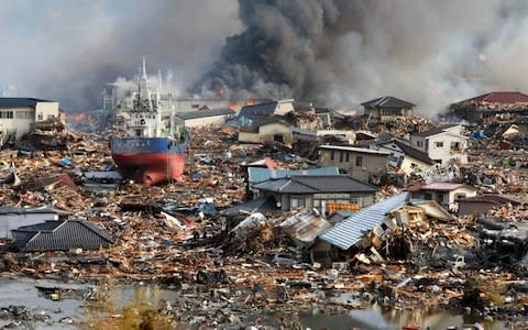 The magnitude 9 earthquake triggered a huge natural disaster - Credit: EPA