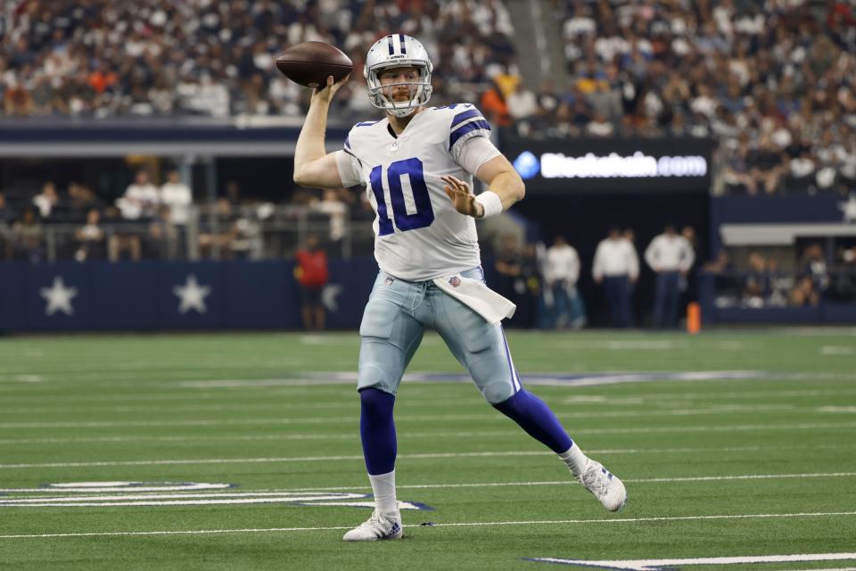 Dallas Cowboys quarterback Cooper Rush (10) throws a pass in the first half of a NFL football game against the Washington Commanders in Arlington, Texas, Sunday, Oct. 2, 2022. (AP Photo/Ron Jenkins)