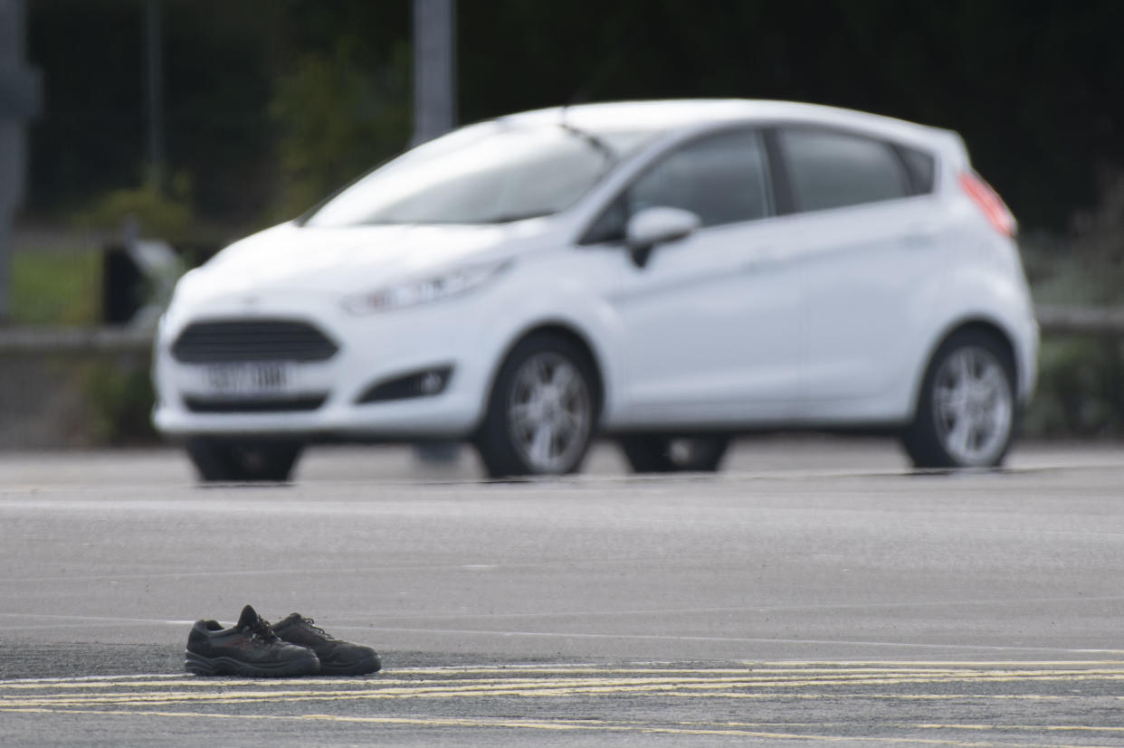 BRIDGEND, WALES - SEPTEMBER 25: A pair of boots left by a Ford worker in their car parking spaces following their final shift on September 25, 2020 in Bridgend, Wales. The Ford plant in Bridgend, which opened in May 1980, will shut down for the last time today, bringing to a close four decades of production at the site. The closure, announced in June 2019, will see the loss of hundreds of jobs. (Photo by Matthew Horwood/Getty Images)