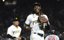 Pittsburgh Pirates shortstop Oneil Cruz (15) laughs while leaving the field during the sixth inning of the team's baseball game against the Boston Red Sox, Thursday, Aug. 18, 2022, in Pittsburgh. (AP Photo/Philip G. Pavely)