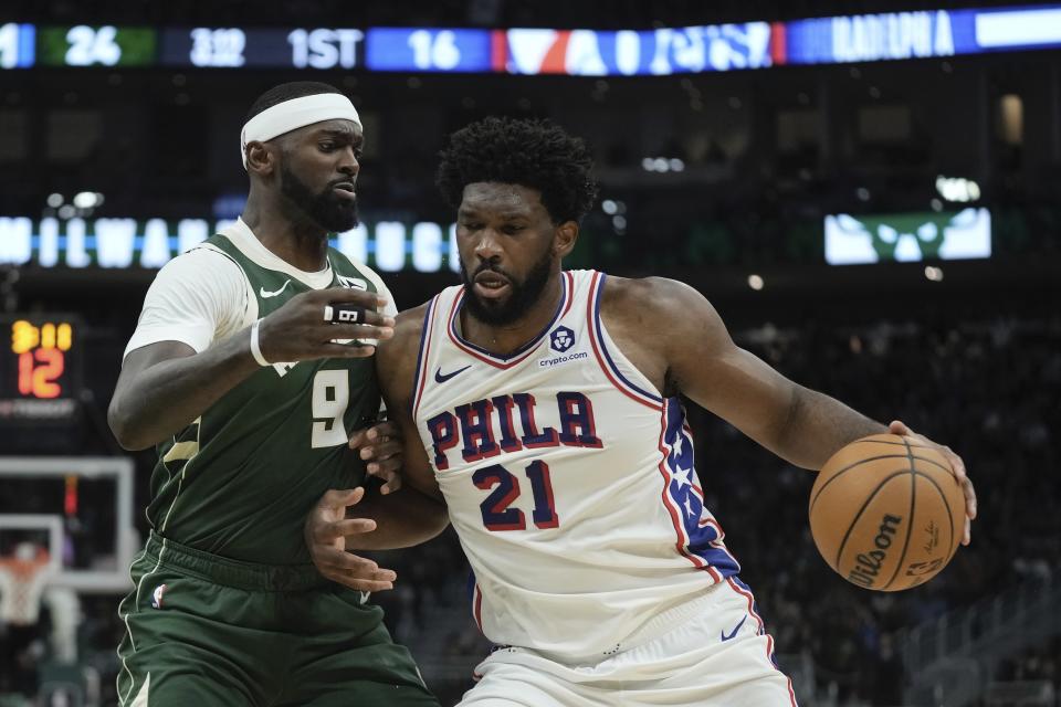 Philadelphia 76ers' Joel Embiid tries to get past Milwaukee Bucks' Bobby Portis during the first half of an NBA basketball game Thursday, Oct. 26, 2023, in Milwaukee. (AP Photo/Morry Gash)