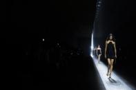 A model wears a creation as part of the Tom Ford women's Fall-Winter 2024-25 collection presented in Milan, northern Italy, Thursday, Feb. 22, 2024. (AP Photo/Luca Bruno)