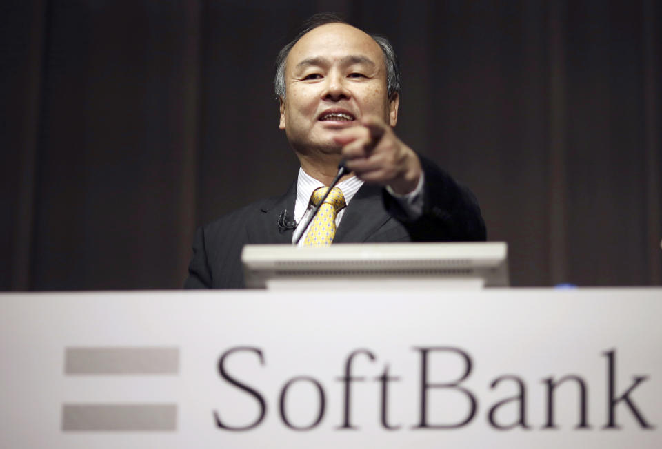 FILE - In this Nov. 4, 2014, file photo, SoftBank founder and Chief Executive Officer Masayoshi Son speaks during a news conference in Tokyo. Japanese technology giant SoftBank has committed billions of dollars to bailing out office space sharing startup WeWork. (AP Photo/Eugene Hoshiko, File)