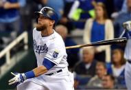 Oct 5, 2014; Kansas City, MO, USA; Kansas City Royals left fielder Alex Gordon (4) watches his 3-RBI double against the Los Angeles Angels during the first inning in game three of the 2014 ALDS baseball playoff game at Kauffman Stadium. Mandatory Credit: Peter G. Aiken-USA TODAY Sports