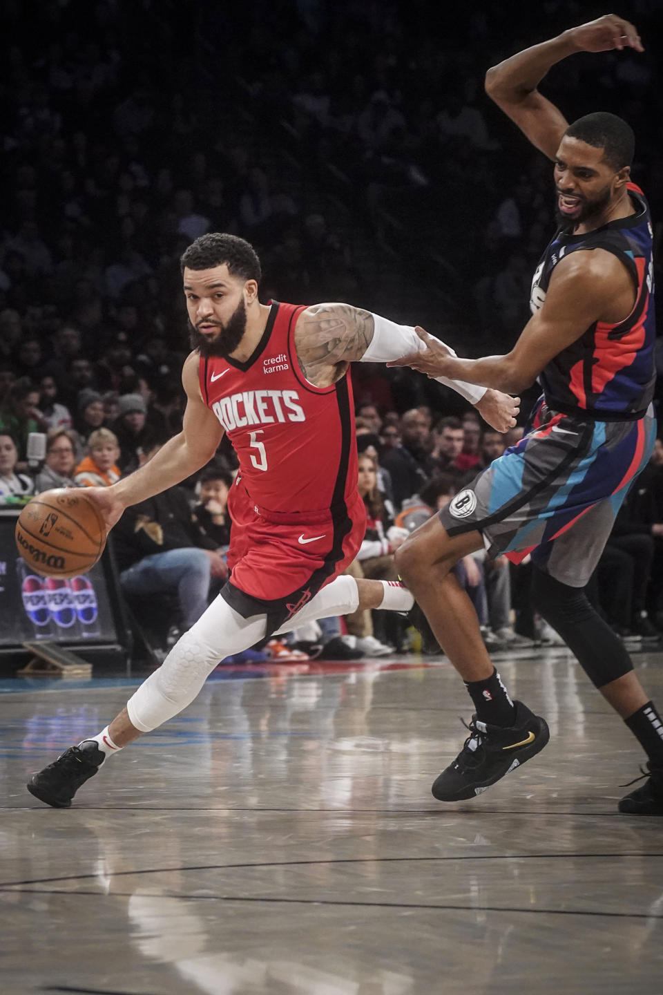 Houston Rockets' Fred VanVleet drives around Brooklyn Nets' Mikal Bridges during the first half of an NBA basketball game Saturday, Jan. 27, 2024, in New York. (AP Photo/Bebeto Matthews)