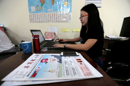 Rama, Editor in Chief of Hushang, a Mandarin language weekly newspaper, works at her office in Islamabad, Pakistan June 9, 2017. REUTERS/Caren Firouz