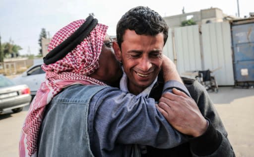 The father of a Palestinian teenager killed by Israeli forces during protests and clashes along the Gaza border cries outside a hospital in the blockaded enclave