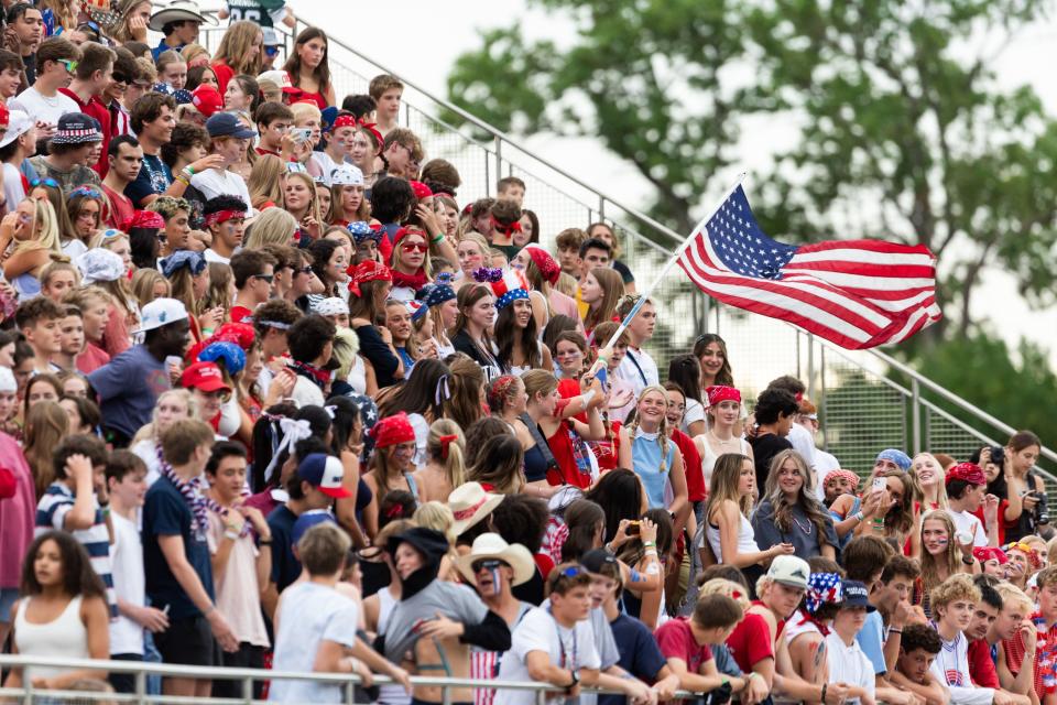 Olympus High School’s student section dresses in Americana for their football game against Provo High School at Olympus High School in Holladay on Friday, Aug. 18, 2023. | Megan Nielsen, Deseret News