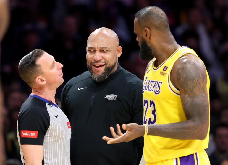 LOS ANGELES, CALIFORNIA - APRIL 9: Lakers head coach Marvin Ham and LeBron James argue with a referee against the Warriors in the third quarter at Crypto.com Arena Tuesday. (Wally Skalij/Los Angeles Times)