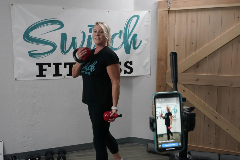 D' Lee Daleo rehearses an exercise routine before doing a live video exercise class at the Switch Fitness center in Elk Grove, Calif., Monday, Nov. 16, 2020. Daleo who is co-owner of Switch Fitness was critical of California Gov. Gavin Newsom's attendance at a birthday party that broke the very rules he has been preaching to slow the spread of the coronavirus. Newsom apologized for attending the party, Nov. 6 with a dozen friends at the pricy French Laundry restaurant in Napa.(AP Photo/Rich Pedroncelli)