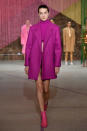 <p>Model wears a fuchsia coat, crop top, skirt, and booties at the Milly Fall/Winter 2018 show. (Photo: Courtesy of Greg Kessler) </p>