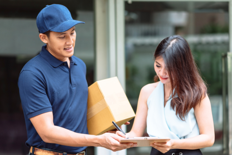 Man Delivering Parcel to Lady