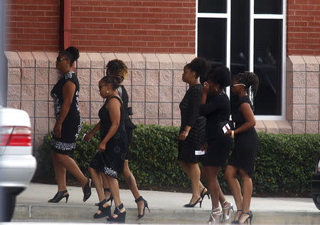 Mourners arrive for the funeral of Kristina Bobbi Brown, the only child of singer Whitney Houston at Saint James United Methodist Church in Alpharetta, Georgia, August 1, 2015. REUTERS/Tami Chappell