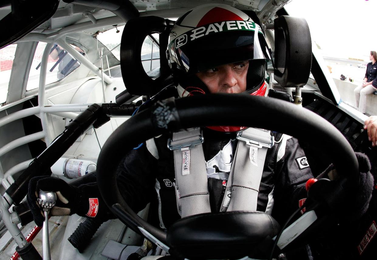 Race car drivers compete in full-body safety gear while sitting in a piping hot car, which puts tremendous strain on the heart. <a href="https://www.gettyimages.com/detail/news-photo/driver-michael-gallegos-climbs-behind-the-wheel-during-the-news-photo/77354033?adppopup=true" rel="nofollow noopener" target="_blank" data-ylk="slk:Grant Halverson/Getty Images for NASCAR;elm:context_link;itc:0;sec:content-canvas" class="link ">Grant Halverson/Getty Images for NASCAR</a>
