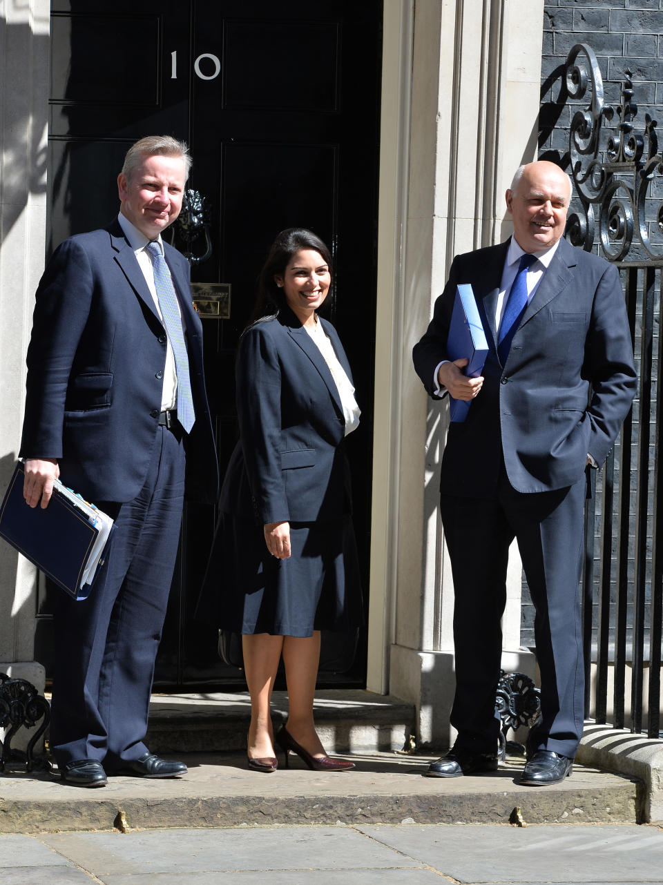 (left to right) Justice Secretary Michael Gove, Minister for Employment Priti Patel and Works and Pensions Secretary Iain Duncan Smith arrive in Downing Street to take part in the first Cabinet meeting since the Conservative Party won the General Election.