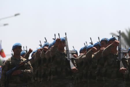 Turkish soldiers take part in a parade to mark the 1974 Turkish invasion of Cyprus in response to a briefly lived Greek-inspired coup, in the Turkish-administered northern part of Nicosia, Cyprus July 20, 2017. REUTERS/Yiannis Kourtoglou