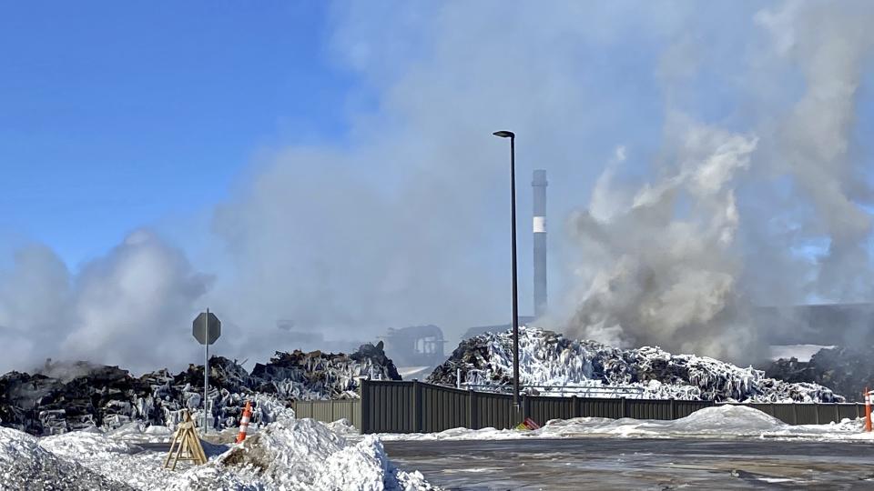 A massive fire at Northern Metal recycling in Becker, Minnesota, that has been burning for days, seemed to be under control Thursday morning, Feb. 20, 2020. The Becker Police Department posted Thursday that “major progress" has been made and that fire crews report the fire is “under control at this point.” (Brian Peterson/Star Tribune via AP)