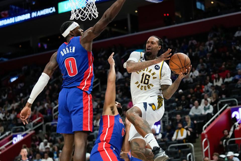 Indiana Pacers forward James Johnson (16) drives on Detroit Pistons center Jalen Duren (0) in the first half at Little Caesars Arena in Detroit on Saturday, March 11, 2023.