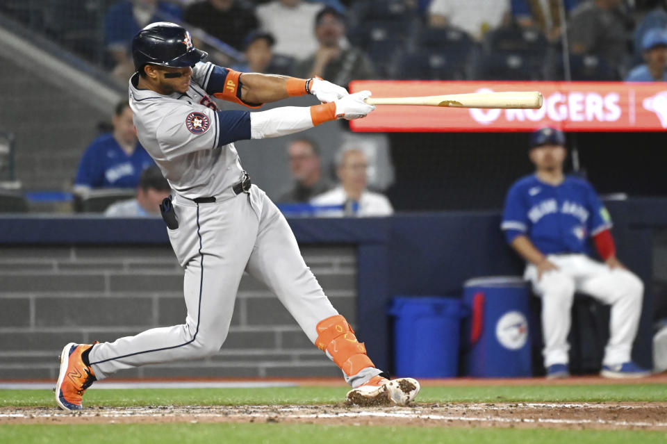 Houston Astros' Jeremy Pena (3) hits a double against the Toronto Blue Jays during the ninth inning of a baseball game, Tuesday, July 2, 2024, in Toronto. (Jon Blacker/The Canadian Press via AP)