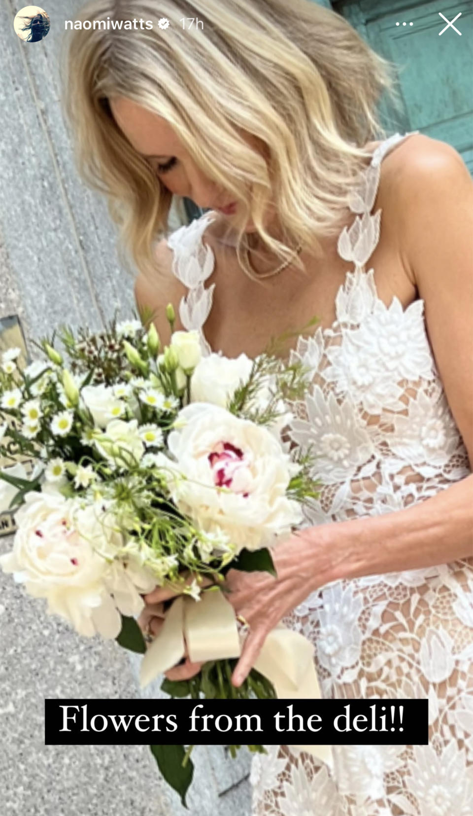 Naomi Watts looked striking in head to toe white lace, holding a bouquet of a variety of white flowers tied in a yellow bow. (Naomi Watts / Instagram)