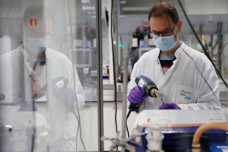 An employee works at a lab at the Spanish pharmaceutical company PharmaMar amid the coronavirus disease (COVID-19) outbreak, in Colmenar Viejo