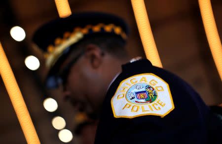 A Chicago Police officer takes part in the graduation ceremony for the Department's newest class of recruits in Chicago, Illinois, April 21, 2014. REUTERS/Jim Young