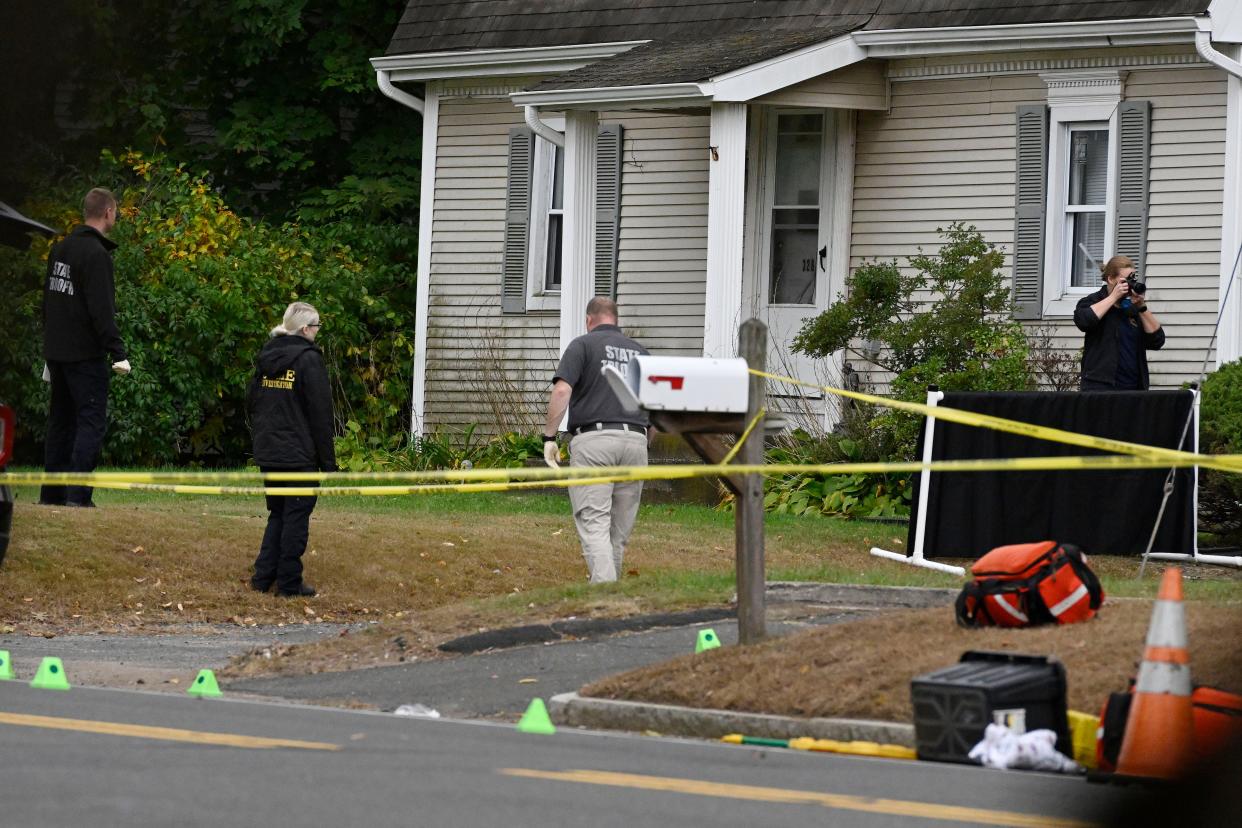 FILE - Police investigate the scene where two police officers were killed the night before in Bristol, Conn., Thursday, Oct. 13, 2022. A segment of footage from a police body camera worn by Officer Alec Iurato was released Sunday, Oct. 16, as part of a preliminary report by the state's Office of the Inspector General in connection with the shooting  (AP Photo/Jessica Hill, File)