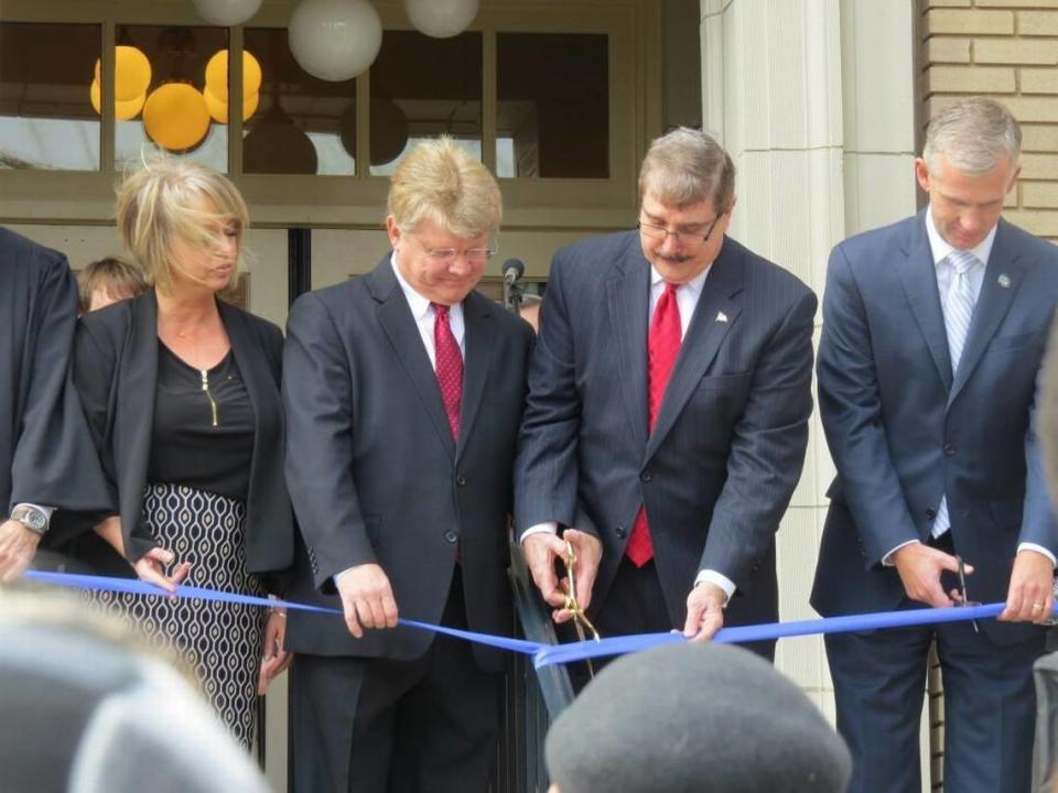 York County Clerk of Court David Hamilton joins other York County leaders in cutting the ribbon of the newly renovated courthouse.