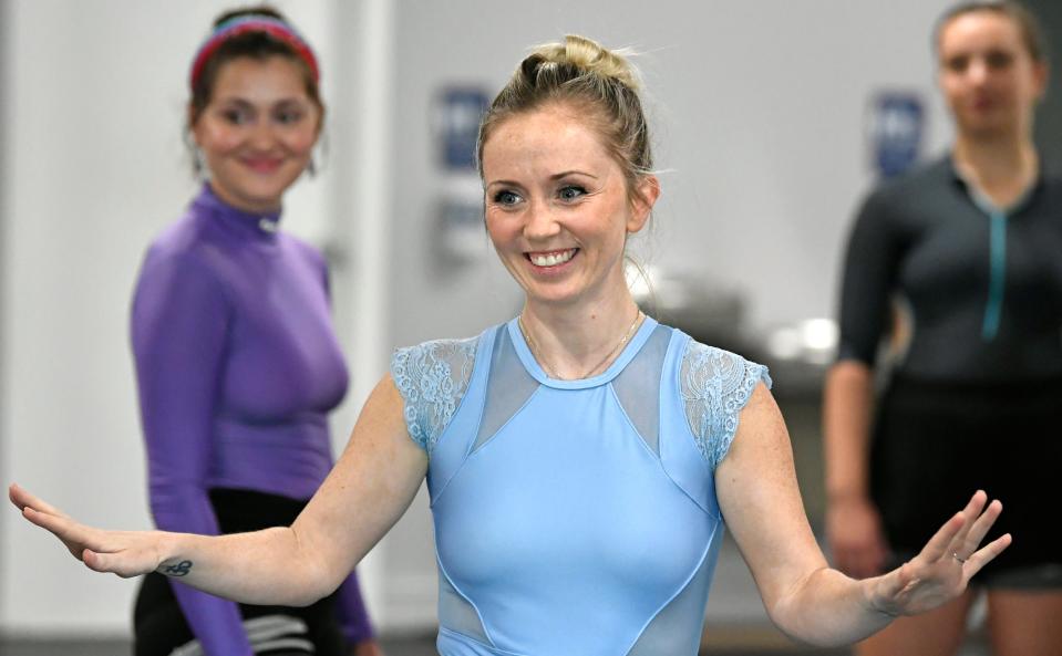 Artistic Director Kate Flowers rehearses with members of her company for “Expressions,” the inaugural program for the new Azara Ballet. Behind Flowers are Elise Csizmadia, left, and Olivia Huseonica.